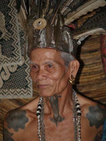 A head hunter complete with tattoos