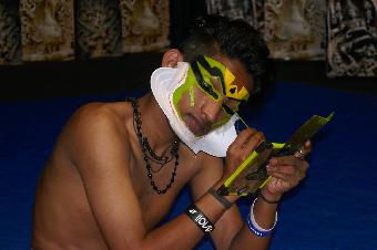 Applying the face make up.